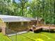 View of the backyard with multi-tiered deck, fenced yard and mossy lawn at 4293 Smithsonia Dr, Tucker, GA 30084