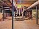 Spacious unfinished basement with visible ductwork, staircase, and potential for customization at 4293 Smithsonia Dr, Tucker, GA 30084