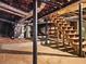 Unfinished basement with utility hookups, concrete floor, and wooden staircase at 4293 Smithsonia Dr, Tucker, GA 30084