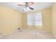 Bedroom with carpet flooring, a ceiling fan, and a window allowing natural light at 4293 Smithsonia Dr, Tucker, GA 30084