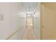 Neutral hallway features modern lighting, and provides access to other rooms in the home at 4293 Smithsonia Dr, Tucker, GA 30084