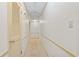 Well-lit hallway features a linen closet and offers access to other rooms in the house at 4293 Smithsonia Dr, Tucker, GA 30084