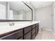 Bathroom featuring double sink vanity, large mirror, shower with tub, and neutral-toned flooring at 786 Brookside Parc Ln, Avondale Estates, GA 30002
