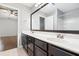This bathroom offers a double vanity with a large mirror and modern fixtures at 786 Brookside Parc Ln, Avondale Estates, GA 30002