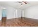 This spacious bedroom features hardwood floors, a ceiling fan, and a walk-in closet at 786 Brookside Parc Ln, Avondale Estates, GA 30002