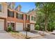 Brick townhome featuring a private garage and front yard, ideal for modern living at 786 Brookside Parc Ln, Avondale Estates, GA 30002