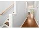 Hallway with hardwood floors and a staircase that has wooden handrails at 786 Brookside Parc Ln, Avondale Estates, GA 30002