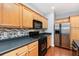 Well-equipped kitchen with stainless steel refrigerator and modern backsplash at 786 Brookside Parc Ln, Avondale Estates, GA 30002
