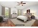 Staged primary bedroom with vaulted ceilings, hardwood floors, and lots of light at 786 Brookside Parc Ln, Avondale Estates, GA 30002