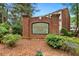 Brookside Parc Townhomes entrance with brick sign surrounded by landscaping at 786 Brookside Parc Ln, Avondale Estates, GA 30002