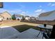 Fenced backyard with a patio and table on a sunny day at 9913 Stretford Rd, Douglasville, GA 30135