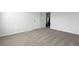 Image of the primary bedroom with light-colored carpet at 9913 Stretford Rd, Douglasville, GA 30135