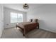 Cozy bedroom with neutral carpet, a ceiling fan, and a full size bed at 9913 Stretford Rd, Douglasville, GA 30135