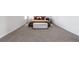 Spacious bedroom showcasing neutral carpet and ample natural light at 9913 Stretford Rd, Douglasville, GA 30135