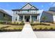 Beautiful two-story home features a welcoming front porch and well-maintained landscaping at 9913 Stretford Rd, Douglasville, GA 30135