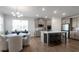 Bright, modern kitchen with stainless steel appliances and a large island at 9913 Stretford Rd, Douglasville, GA 30135
