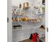 Well-organized walk-in pantry with white wire shelving, offering ample storage space at 9913 Stretford Rd, Douglasville, GA 30135