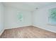 This spacious bedroom boasts wood-look flooring, neutral paint, and natural lighting at 1723 Ritcherson Se St, Marietta, GA 30060