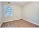 Bedroom featuring wood-look flooring and a bright window at 1723 Ritcherson Se St, Marietta, GA 30060