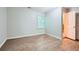 Cozy bedroom with wood-look flooring and a bright window at 1723 Ritcherson Se St, Marietta, GA 30060