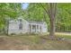 Charming one-story home with brick facade, covered porch, attached garage and mature trees at 1723 Ritcherson Se St, Marietta, GA 30060