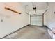 Clean garage featuring a door, overhead storage, and concrete flooring at 1723 Ritcherson Se St, Marietta, GA 30060