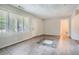 Open living room with tile floors, fresh paint, lots of windows, and neutral decor at 1723 Ritcherson Se St, Marietta, GA 30060