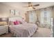 Bedroom with Eiffel Tower art and pink bedding at 233 Millstone Pkwy, Woodstock, GA 30188