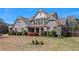 Beautiful brick home with a well-maintained lawn and landscape at 233 Millstone Pkwy, Woodstock, GA 30188