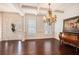 Bright foyer featuring hardwood floors, white trim, and coffered ceilings at 233 Millstone Pkwy, Woodstock, GA 30188
