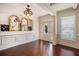 Elegant foyer with hardwood floors, decorative mirrors, and white trim at 233 Millstone Pkwy, Woodstock, GA 30188