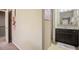 Hallway with view of bathroom featuring vanity and artwork at 233 Millstone Pkwy, Woodstock, GA 30188