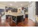 Spacious kitchen with a large center island, stainless steel appliances, and dark cabinetry at 233 Millstone Pkwy, Woodstock, GA 30188