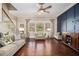 Cozy living room with hardwood floors, plush seating, and natural light at 233 Millstone Pkwy, Woodstock, GA 30188