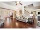 Spacious living room with hardwood floors and staircase at 233 Millstone Pkwy, Woodstock, GA 30188