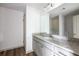 Modern bathroom features a granite countertop and white cabinets at 358 Forkview Dr, Lawrenceville, GA 30044