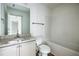 Bathroom with granite counters, white cabinets, and combined tub and shower at 358 Forkview Dr, Lawrenceville, GA 30044