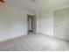 Bedroom with an open closet and plush carpet at 358 Forkview Dr, Lawrenceville, GA 30044