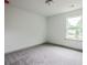 Bedroom featuring a large window and neutral colored carpet at 358 Forkview Dr, Lawrenceville, GA 30044