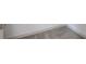 Close up of a shower head, wall, and textured rug at 358 Forkview Dr, Lawrenceville, GA 30044