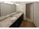 Bathroom features a double vanity with granite countertops, and linen closet at 485 Sherman Way, Decatur, GA 30033