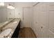 Bathroom features a double vanity with granite countertops, and linen closet at 485 Sherman Way, Decatur, GA 30033