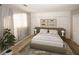 Staged bedroom with comfortable furnishings and natural light. (Virtually Staged) at 485 Sherman Way, Decatur, GA 30033