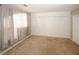 Bedroom with large window and neutral carpeting at 485 Sherman Way, Decatur, GA 30033