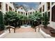 Courtyard featuring lush landscaping, fountains, and well-maintained building facades at 485 Sherman Way, Decatur, GA 30033