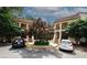 Two-story condo building with parking, stairs to units, wrought iron railings, and a center landscaped island at 485 Sherman Way, Decatur, GA 30033
