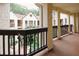 Community with neutral stucco facade, dark wood accents and railings, and lush landscaping at 485 Sherman Way, Decatur, GA 30033