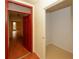 Foyer with hardwood floors, bright red door, and natural light at 485 Sherman Way, Decatur, GA 30033