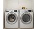 Laundry room featuring modern, front-loading washer and dryer at 485 Sherman Way, Decatur, GA 30033