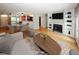 Staged living room and dining area showcasing an open floorplan and hardwood floors at 485 Sherman Way, Decatur, GA 30033